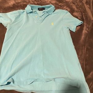Light Blue polo with yellow brand logo